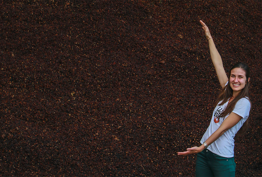 Daniela Uribe with a mountain of cascara. (Photo courtesy of Lazy Bear Tea/Civil Eats)