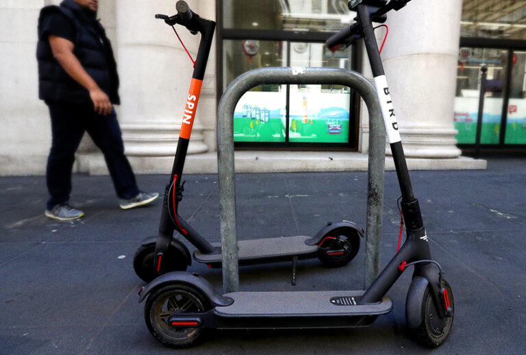Bird and Spin scooters sit parked on a street corner in San Francisco, California. (Getty/Justin Sullivan)