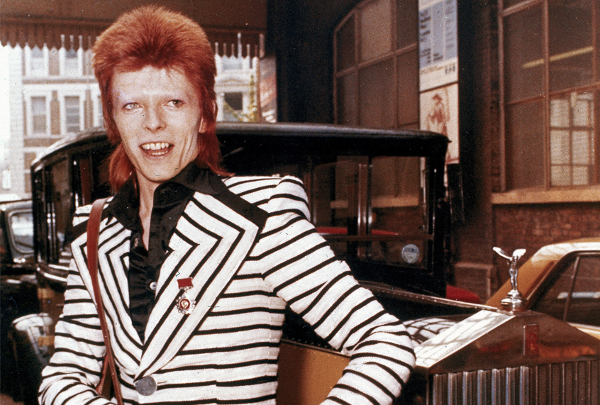 David Bowie poses beside his Rolls Royce in May 1973. (AP)