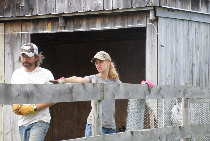 The author and her husband Jason working on their farm in New York. (Bennett Schmitt)