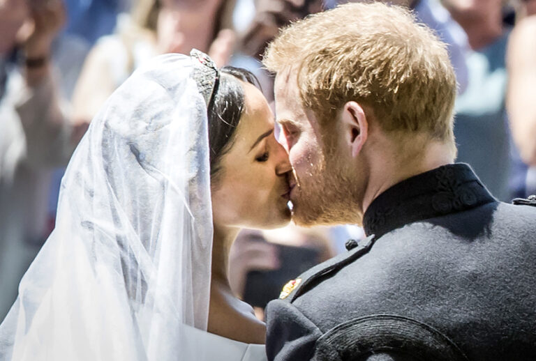 Meghan Markle and Prince Harry kiss on the steps of St George's Chapel at Windsor Castle following their wedding, Saturday, May 19, 2018. (AP/Danny Lawson)