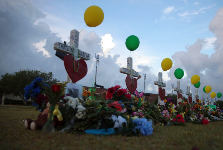 A memorial to the victims of the May 18 shooting line the lawn in front of Santa Fe High School on May 21, 2018 in Santa Fe, Texas. T (Getty/Scott Olson)