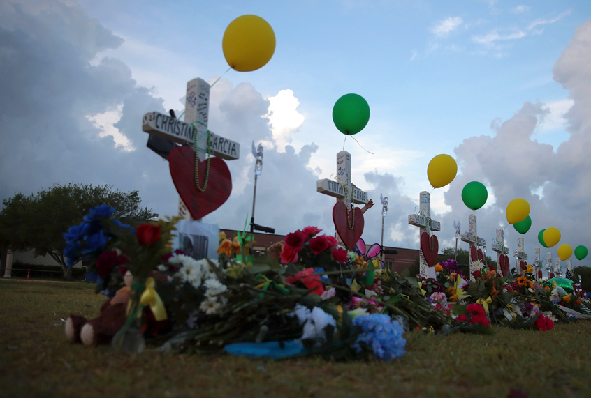 A memorial to the victims of the May 18 shooting line the lawn in front of Santa Fe High School on May 21, 2018 in Santa Fe, Texas. T (Getty/Scott Olson)