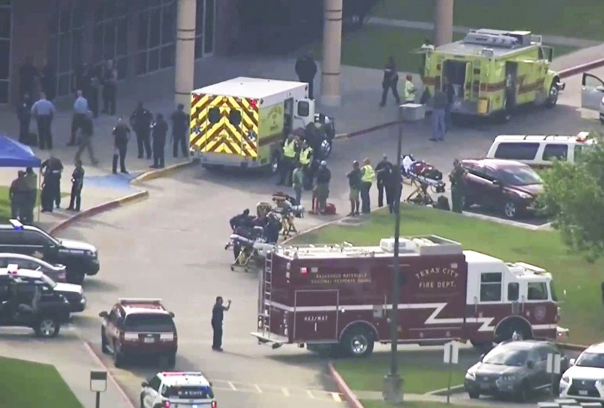 In this image taken from video emergency personnel and law enforcement officers respond to a high school near Houston after an active shooter was reported on campus, Friday, May 18, 2018, in Santa Fe, Texas. (AP/KTRK-TV)