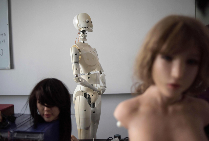 Robots in a lab of a doll factory of EXDOLL, a firm based in China. (Getty/Fred Dufour)