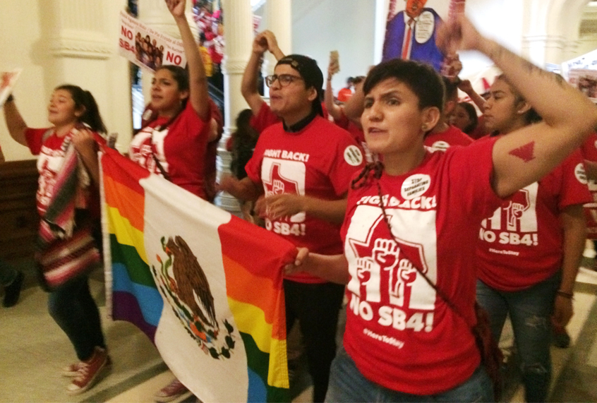 Demonstrators march in Austin on Monday, May 29, 2017, protesting the state's newly passed anti-sanctuary cities bill. (AP/Meredith Hoffman)