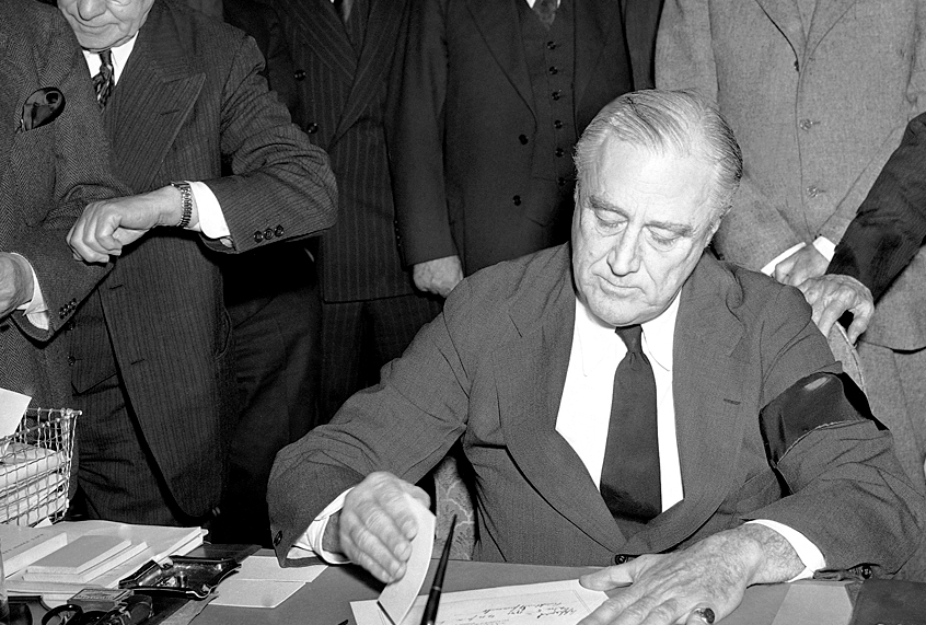 Fraklin Roosevelt signing the declaration of war on Dec. 8, 1941. (AP Photo)