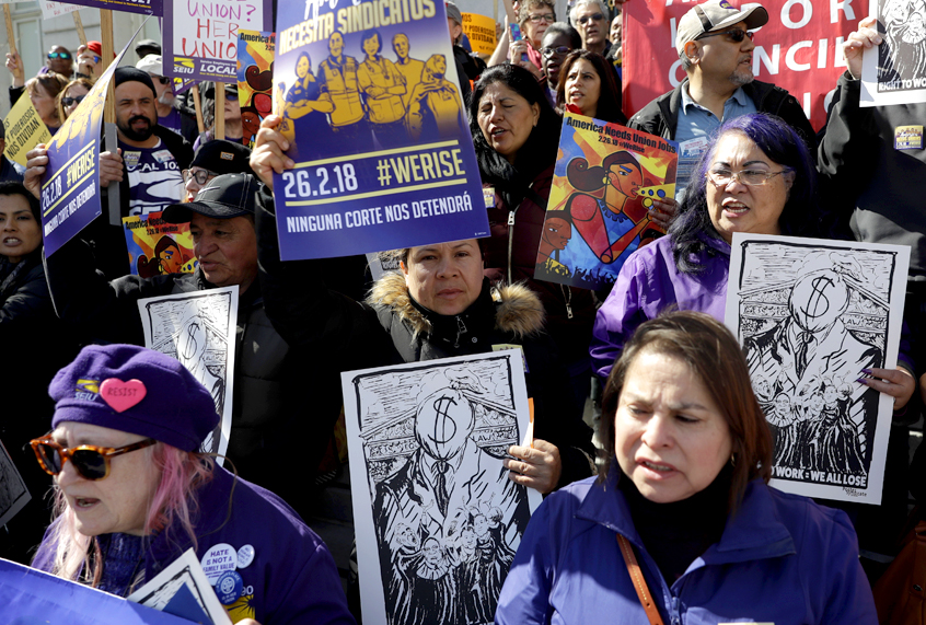 Protesters gather during a demonstration involving various labor union groups. (AP/Marcio Jose Sanchez)
