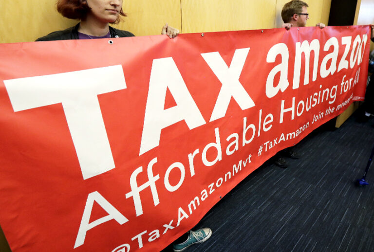 Demonstrators opposing the repeal of a tax on large companies such as Amazon and Starbucks in Seattle. (AP/Ted S. Warren)