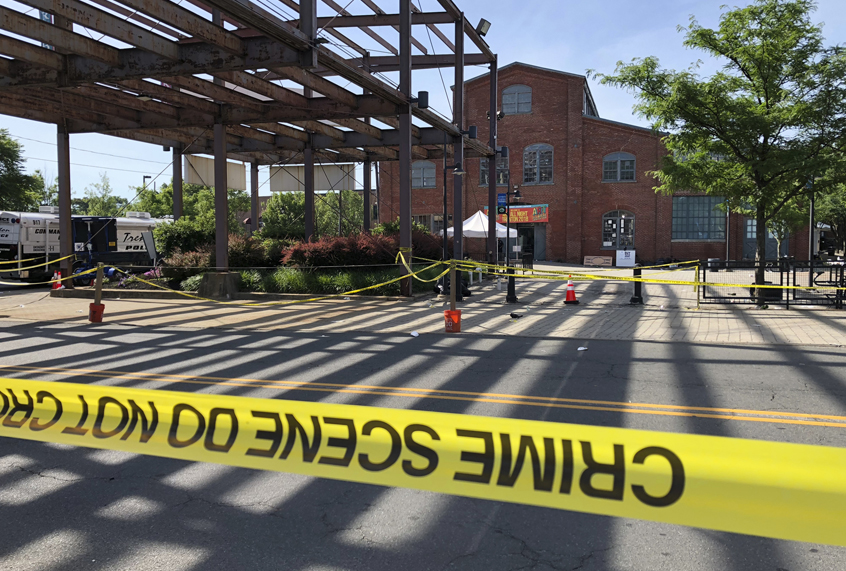 The brick Roebling Wire Works building, background, in Trenton, N.J., hours after a shooting broke out there at an all-night art festival early Sunday, June 17, 2018. (AP/Mike Catalini)