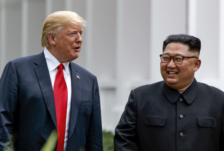 Donald Trump walks with Kim Jong Un, June 12, 2018 in Singapore. (AP/Evan Vucci)