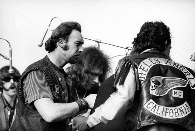 Hells Angels and Jorma Kaukonen, Jefferson Airplane at Altamont 
Dec. 1969 (© Robert Altman 2009)