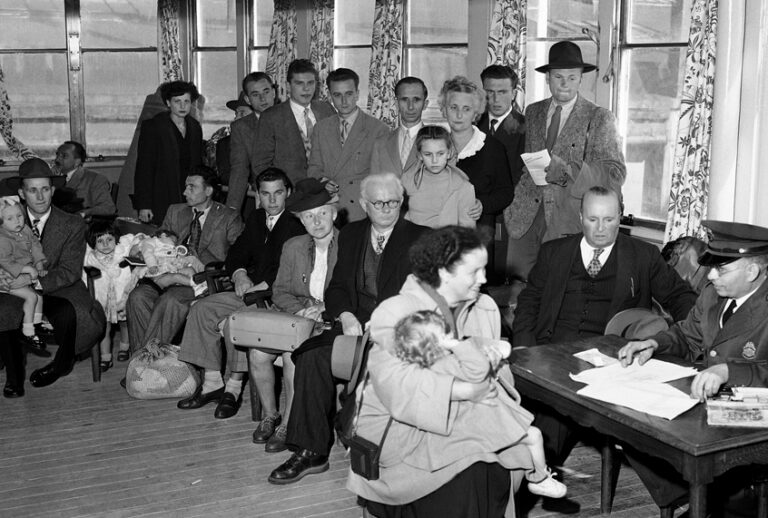 German immigrants are questioned by immigration officers aboard the liner Saturnia on arrival in New York City. They were ordered to Ellis Island for further questioning under the 1950 Security Act. (AP/John Lindsay)