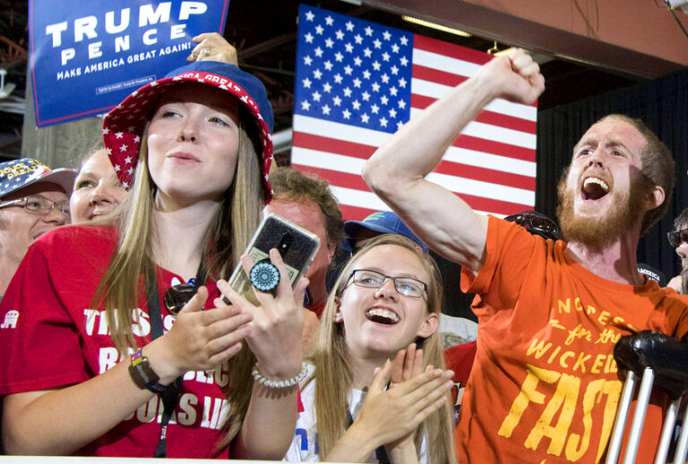 Supporters cheer as Donald Trump arrives to speach during a "Make America Great again" rally. (Getty/Jim Watson)