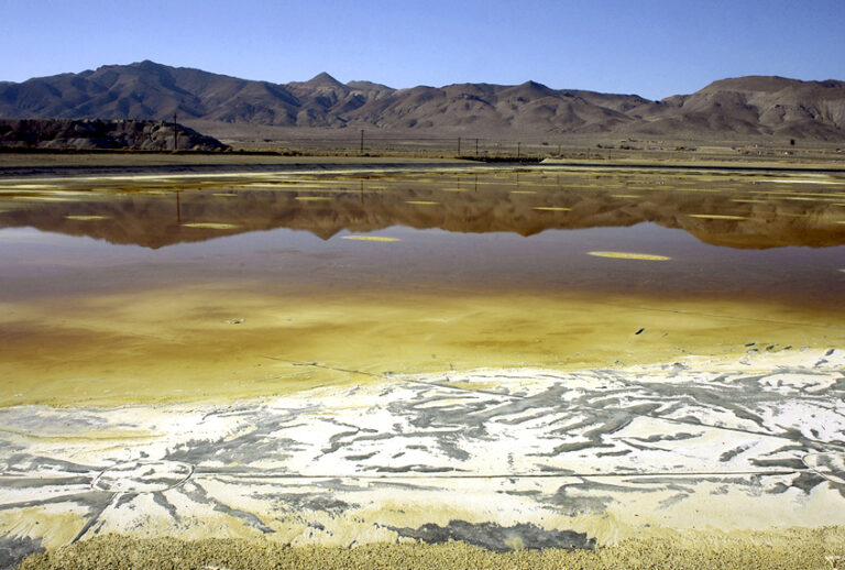An evaporation pond holds contaminated fluid and sediment at the former Anaconda copper mine near Yerington, Nev. (AP/Debra Reid)