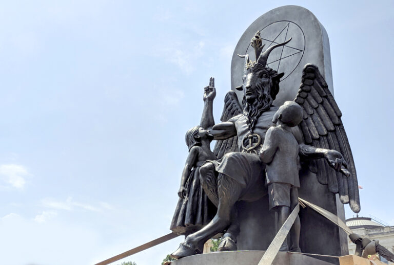 The Satanic Temple unveils its statue of Baphomet, a winged-goat creature, at a rally for the first amendment in Little Rock, Ark., Thursday, Aug. 16, 2018. (AP/Hannah Grabenstein)