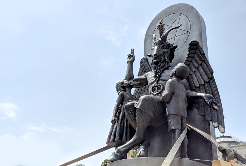 The Satanic Temple unveils its statue of Baphomet, a winged-goat creature, at a rally for the first amendment in Little Rock, Ark., Thursday, Aug. 16, 2018. (AP/Hannah Grabenstein)