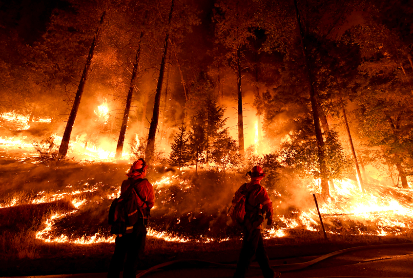 Firefighters try to control a back burn as the Carr fire continues to spread on July 31, 2018. (Getty/Mark Ralston)