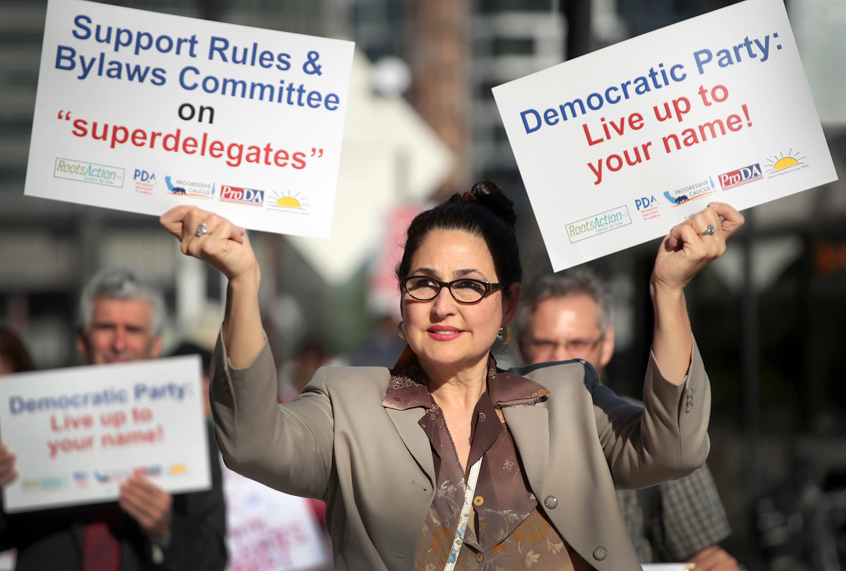 Demonstrators protest outside the Hyatt Hotel where the Democratic National Committee (DNC) were kicking off their summer meeting on August 23, 2018 in Chicago, Illinois. (Getty/Scott Olson)
