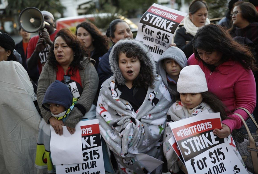 People protest near a McDonald's restaurant along the Las Vegas Strip, Nov. 29, 2016. (AP/John Locher)