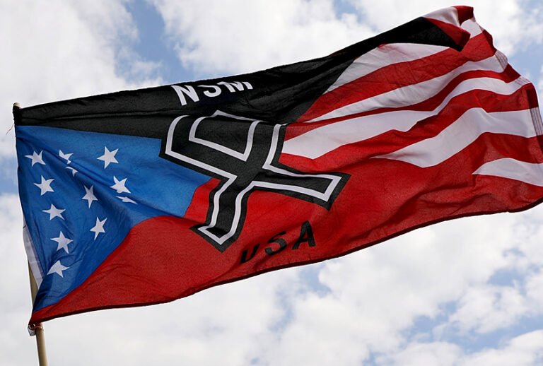 Members and supporters of the National Socialist Movement, one of the largest neo-Nazi groups in the US, hold a rally. (Getty/Spencer Platt)