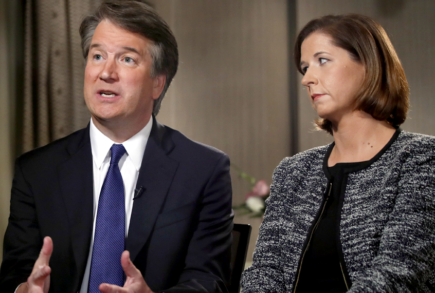 Brett Kavanaugh, with his wife Ashley Estes Kavanaugh, answers questions during a FOX News interview, Monday, Sept. 24, 2018, in Washington, about allegations of sexual misconduct against the Supreme Court nominee. (AP/Jacquelyn Martin)