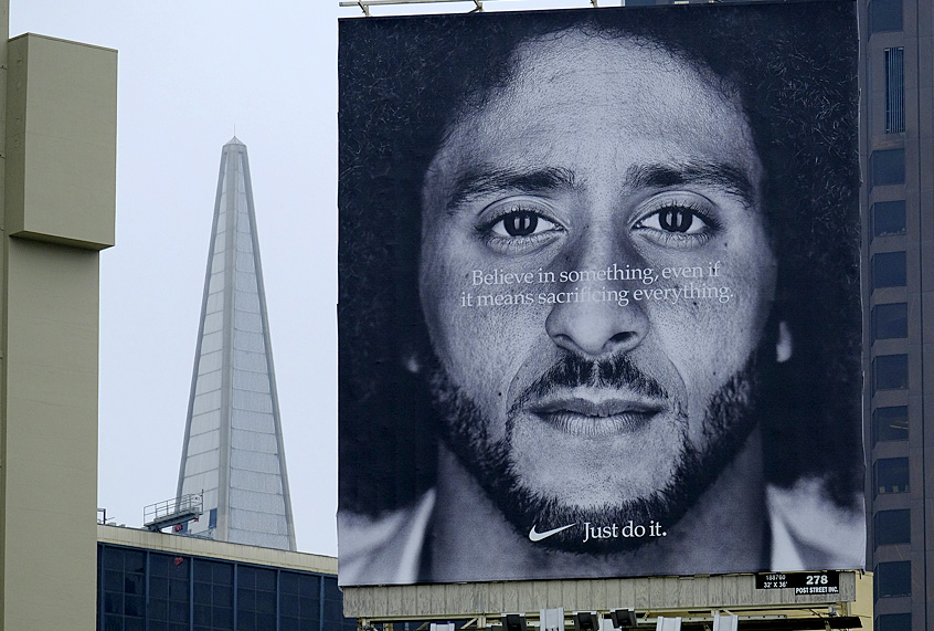 A billboard stands on top of a Nike store showing former San Francisco 49ers quarterback Colin Kaepernick. (AP/Eric Risberg)