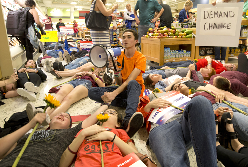 David Hogg and other demonstrators lie on the floor at a Publix Supermarket in Coral Springs, Fla., May 25, 2018. (AP/Wilfredo Lee)