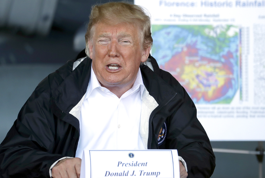 Donald Trump speaks while attending a briefing after arriving at Marine Corps Air Station Cherry Point to visit areas impacted by Hurricane Florence, Wednesday, Sept. 19, 2018, in Havelock, N.C. (AP/Evan Vucci)
