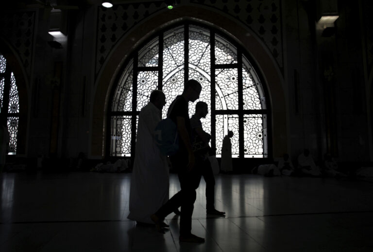 Muslim pilgrims perform the ritual walk back and forth between the two small hills of Safa and Marwah, at the Grand Mosque, in Mecca, Saudi Arabia, (AP/Khalil Hamra)
