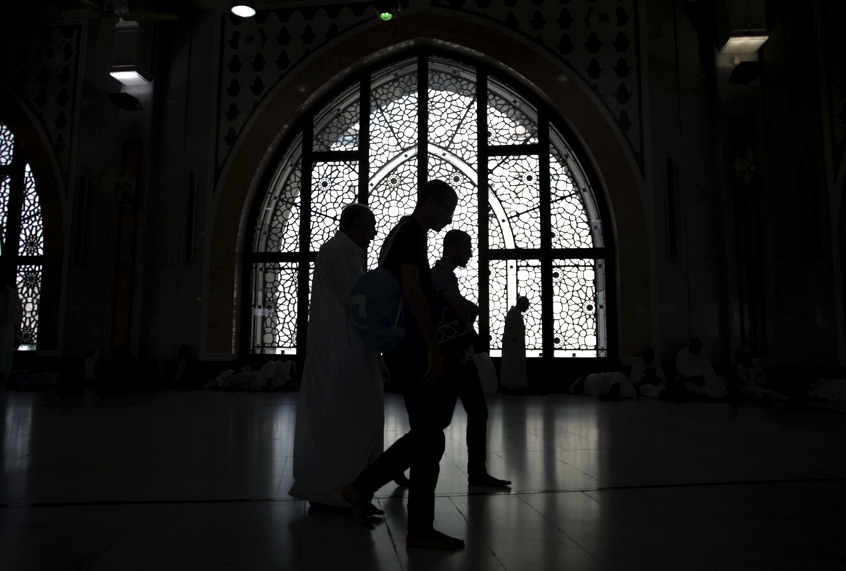 Muslim pilgrims perform the ritual walk back and forth between the two small hills of Safa and Marwah, at the Grand Mosque, in Mecca, Saudi Arabia, (AP/Khalil Hamra)