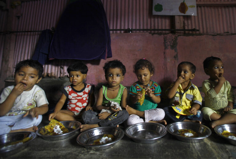 Malnourished children eat a meal at the Apanalaya Center in Mumbai, India, Oct. 9, 2012. (AP/Rafiq Maqbool)
