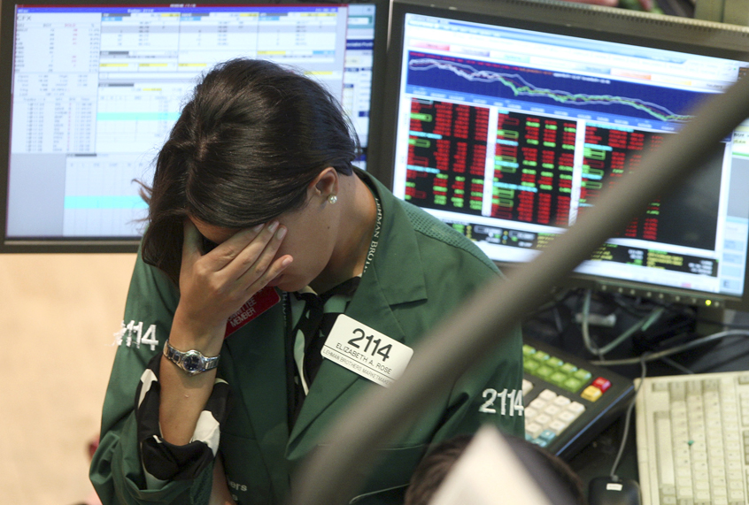 Elizabeth Rose, a specialist with Lehman Brothers MarketMakers, works her post on the trading floor of the New York Stock Exchange, Monday, Sept. 15, 2008. (AP/David Karp)