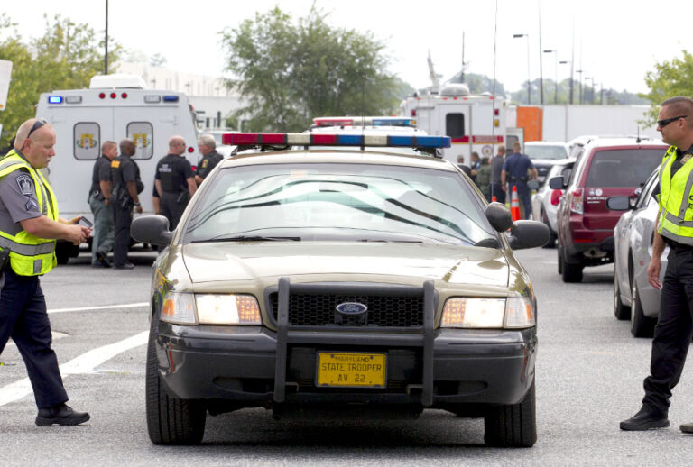 Aberdeen police officers block the entrance of industrial complex where several people had been shot, in Harford County, Md, Thursday, Sept. 20, 2018. (AP/Jose Luis Magana)