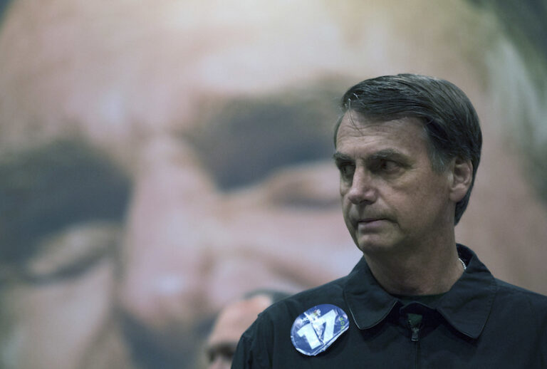 Presidential frontrunner Jair Bolsonaro, of the Social Liberal Party arrives to a press conference in Rio de Janeiro, Brazil, Thursday, Oct. 11, 2018. (AP Photo/Leo Correa) (AP)