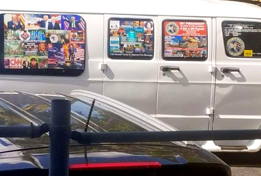 This Nov. 1, 2017, photo shows a van with windows covered with an assortment of stickers in Well, Fla. Federal authorities took Cesar Sayoc into custody on Friday, Oct. 26, 2018, and confiscated his van, which appears to be the same one, at an auto parts store in Plantation, Fla., in connection with the mail-bomb scare that has targeted prominent Democrats from coast to coast. (Courtesy of Lesley Abravanel via AP)