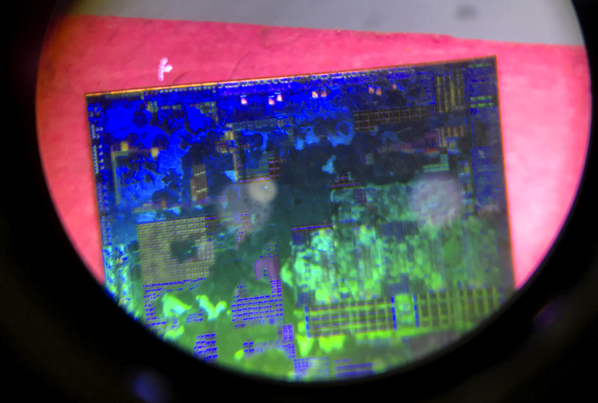 A Chinese microchip is seen through a microscope. (AP/Ng Han Guan))