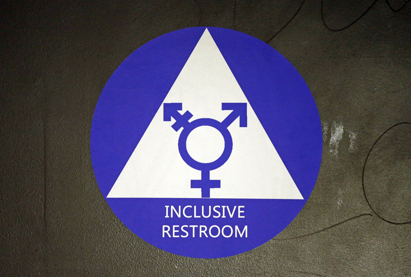 A sticker designates a gender neutral bathroom. (AP/Elaine Thompson)
