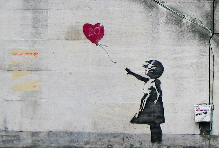 The original version of "Girl With Balloon" by Banksy. A framed print of the mural shredded itself after being auctioned for $1.4 million dollars. (Wikiart)