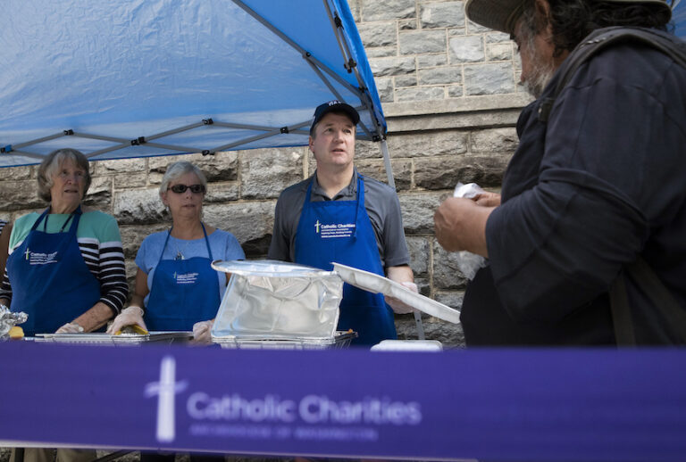 Supreme Court Associate Justice Brett Kavanaugh serves meals to the homeless as he volunteers with Catholic Charities, Oct. 10, 2018, in Washington. (AP/Alex Brandon)