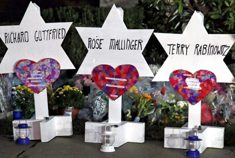 This photo shows some of Stars of David with names of those killed at the Tree of Life Synagogue in Pittsburgh in Saturday's shooting, at a memorial outside the synagogue, Sunday, Oct. 28, 2018. (AP/Gene J. Puskar)