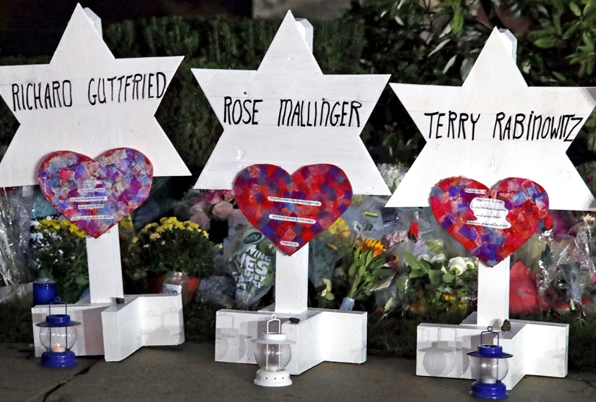 This photo shows some of Stars of David with names of those killed at the Tree of Life Synagogue in Pittsburgh in Saturday's shooting, at a memorial outside the synagogue, Sunday, Oct. 28, 2018. (AP/Gene J. Puskar)