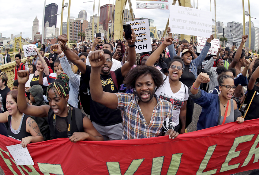 Protestors cross the Roberto Clemente bridge to protest the killing of Antwon Rose Jr., June 22, 2018. (AP/Gene J. Puskar)