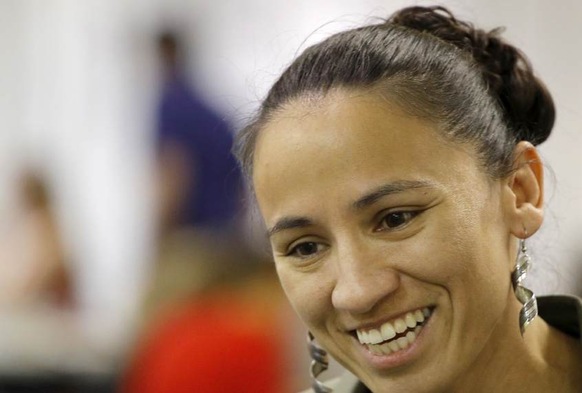 Democratic Congressional candidate Sharice Davids talks to volunteer at her campaign office Monday, Oct. 1, 2018, in Overland Park, Kan. Davids is challenging Republican incumbent Kevin Yoder in Kansas' 3rd District. (AP Photo/Charlie Riedel) (AP)