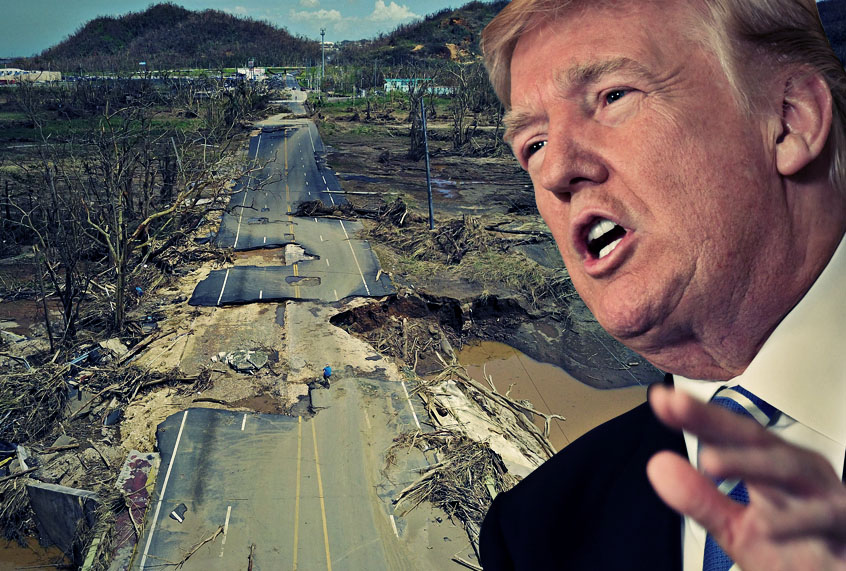 A man rides his bicycle through a damaged road in Toa Alta, Puerto Rico, on September 24, 2017 following the passage of Hurricane Maria. (Getty/Salon)