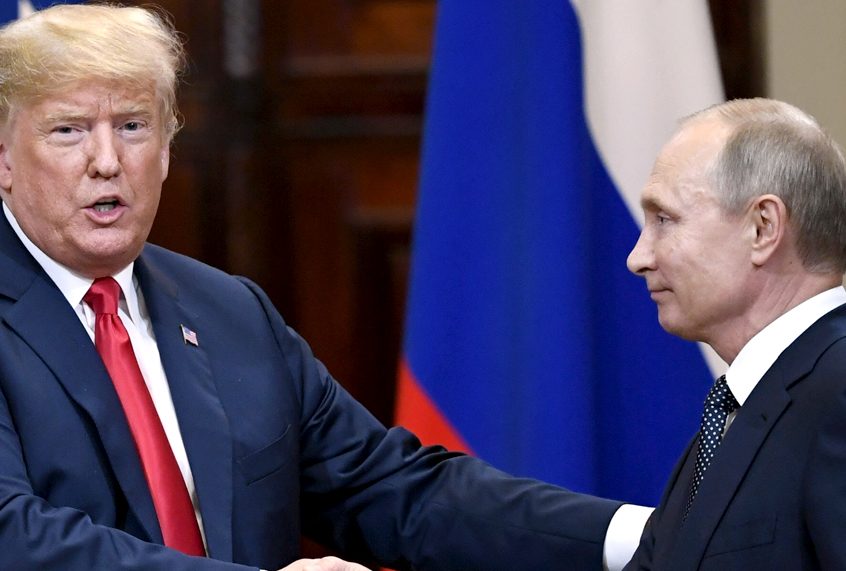 U.S. President Donald Trump and Russian President Vladimir Putin shake hands after a joint press conference at the Presidential Palace in Helsinki, Finland, July 16, 2018. (AP/Jussi Nukari)