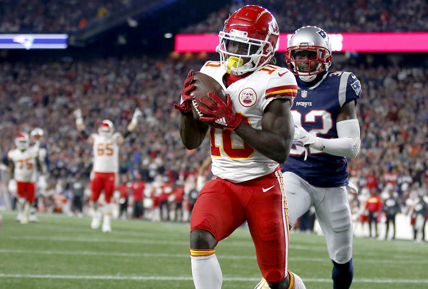 Kansas City Chiefs wide receiver Tyreek Hill catches a touchdown pass in front of New England Patriots defensive back Devin McCourty, Sunday, Oct. 14, 2018, in Foxborough, Mass. (AP/Michael Dwyer)