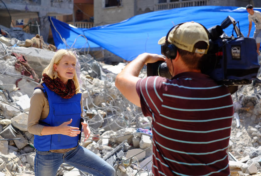 Journalist Jane Ferguson 
reporting from scene of an Israeli air strike in Gaza in 2014. (Jane Ferguson)
