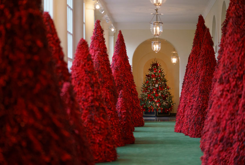 Topiary trees line the East colonnade during the 2018 Christmas Press Preview at the White House in Washington, Monday, Nov. 26, 2018. (AP/Carolyn Kaster)