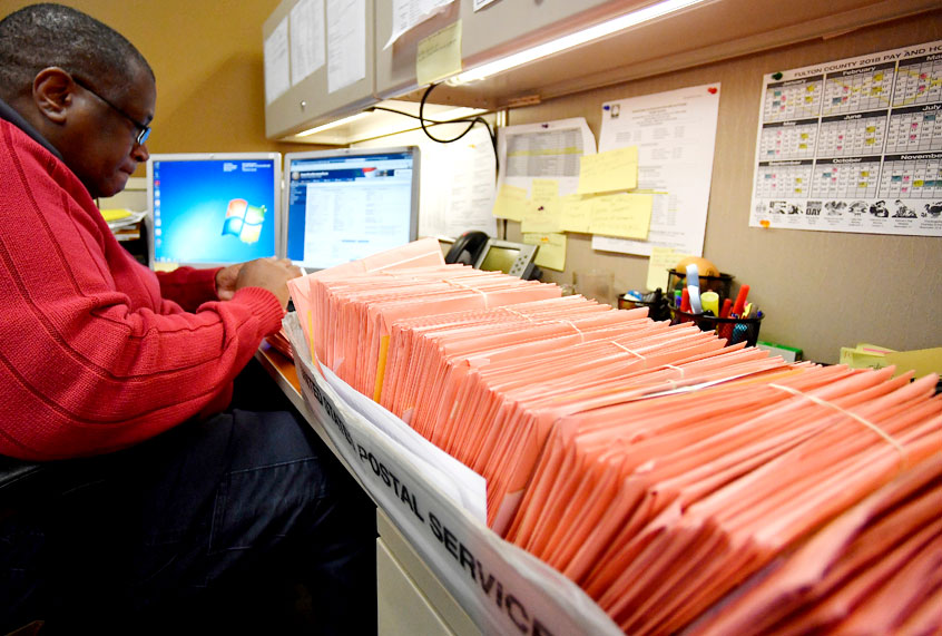 Fulton County election worker counts provisional ballots, Wednesday, Nov. 7, 2018, in Atlanta. (AP/Mike Stewart)